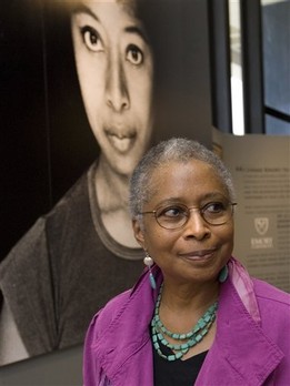 Alice Walker stands in front of a picture of herself from 1974 as she tours her archives at Emory University, Thursday, April 23, 2009, in Atlanta.